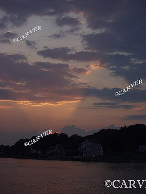 A Shining Pillar
Sunset at Obear Park in Beverly. A bright "fan" of light emerges from behind
the cloud cover. 
Keywords: sunset; pillar; park; colors; river; obear; Beverly; art; photograph; picture; print